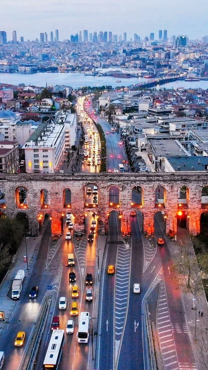 Evening view of Istanbul skyline beyond the Valens Aqueduct